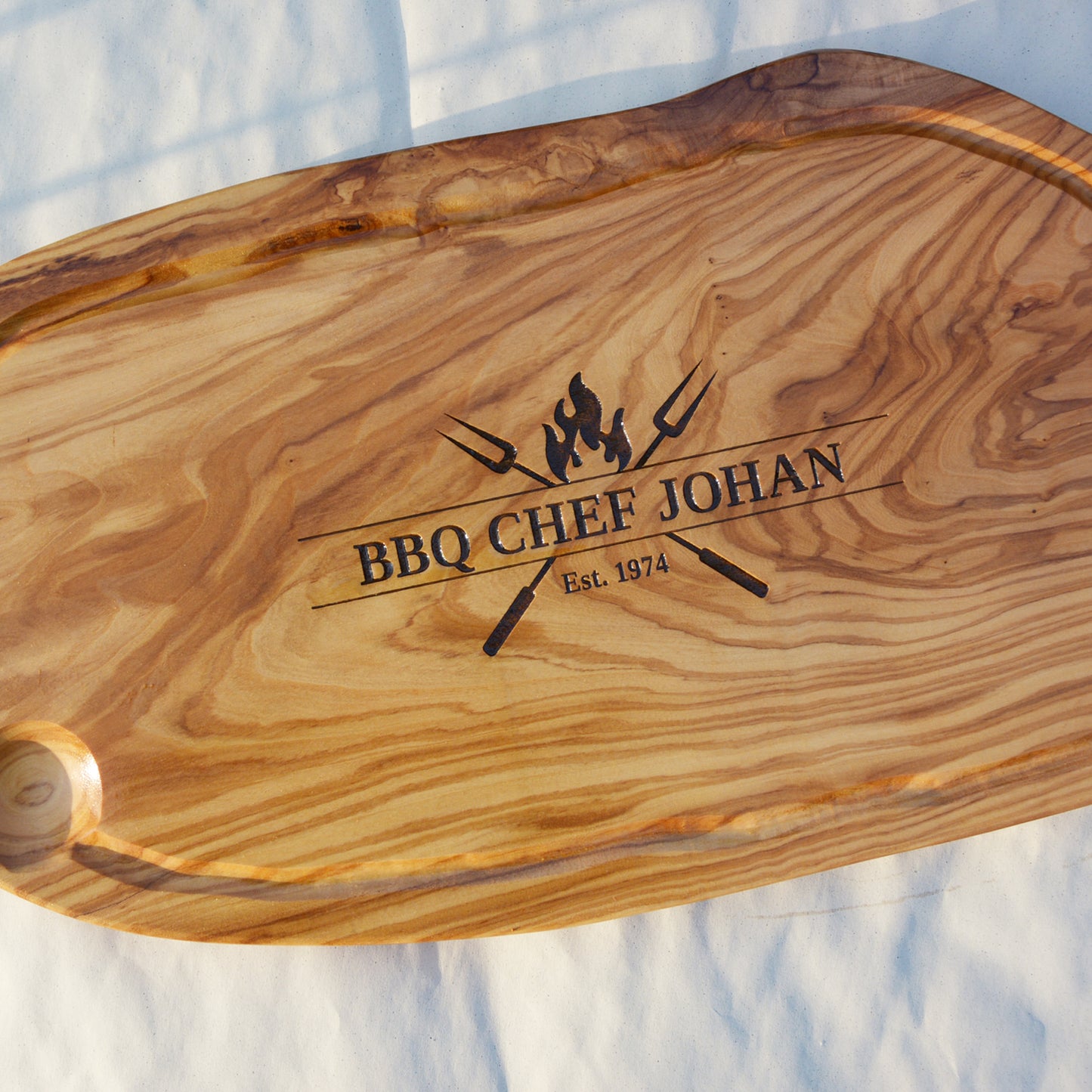 ON FIRE - personalized engraving on an olive wood board